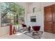 Bright sitting room with a large window, natural light, and decor at 14619 E Desert Vista Trl, Scottsdale, AZ 85262