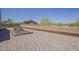 Low-maintenance backyard landscaping with a concrete block fence at 1726 E Primera Dr, Casa Grande, AZ 85122