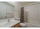 Bathroom featuring a tub-shower combo with a colorful shower curtain and sink at 1726 E Primera Dr, Casa Grande, AZ 85122