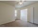 Bedroom featuring neutral carpet and double doors that leads to an additional room at 1726 E Primera Dr, Casa Grande, AZ 85122