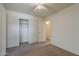 Bedroom with neutral carpet and closet; a ceiling fan provides comfort at 1726 E Primera Dr, Casa Grande, AZ 85122