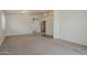 Spacious living room with neutral carpet, chandelier lighting, and doorway views to other rooms at 1726 E Primera Dr, Casa Grande, AZ 85122