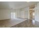 Open living room featuring a ceiling fan, sliding glass door, and tile flooring at 1726 E Primera Dr, Casa Grande, AZ 85122
