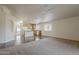 Open concept living space featuring tile and carpeted areas with natural lighting at 1726 E Primera Dr, Casa Grande, AZ 85122