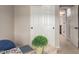 Inviting bedroom with a view of an open doorway, complemented by a small plant atop the desk at 17907 W Cedarwood Ln, Goodyear, AZ 85338