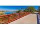 Scenic bridge over a creek leading to the community lake and recreational areas at 17907 W Cedarwood Ln, Goodyear, AZ 85338