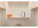 Bright closet with custom shelving provides ample storage space, ideal for organizing fashion and accessories at 17907 W Cedarwood Ln, Goodyear, AZ 85338