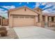 Single story home featuring a two car garage, stone accents, and low maintenance desert landscaping at 17907 W Cedarwood Ln, Goodyear, AZ 85338