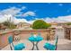 Inviting front porch and patio with stone accents, outdoor seating, cocktails, plants and a view at 17907 W Cedarwood Ln, Goodyear, AZ 85338