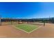 Outdoor pickleball court with mountain views and ample space for recreational play at 17907 W Cedarwood Ln, Goodyear, AZ 85338