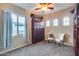 Bedroom with ample natural light, comfortable seating, and plenty of storage space at 19414 W Pasadena Ave, Litchfield Park, AZ 85340