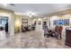 Large open-concept dining area with tile floors and ample space for a sizable gathering at 19414 W Pasadena Ave, Litchfield Park, AZ 85340