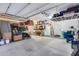 Bright, spacious garage with plenty of room for storage and projects, featuring an organized shelving system at 19414 W Pasadena Ave, Litchfield Park, AZ 85340