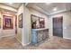 Elegant hallway with decorative furnishings, tile flooring, and a beautiful entryway at 19414 W Pasadena Ave, Litchfield Park, AZ 85340