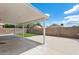 A covered patio and low-maintenance yard create a relaxing outdoor space at 1945 W Renaissance Ave, Apache Junction, AZ 85120