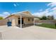 Covered patio extends living to a low-maintenance yard, ideal for relaxing outdoors at 1945 W Renaissance Ave, Apache Junction, AZ 85120