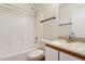 Cozy bathroom with a shower over the tub and a single sink vanity at 1945 W Renaissance Ave, Apache Junction, AZ 85120