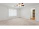 This bedroom is light and airy, with a closet viewable through the doorway at 1945 W Renaissance Ave, Apache Junction, AZ 85120
