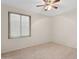 This bedroom features neutral flooring and a bright window with blinds at 1945 W Renaissance Ave, Apache Junction, AZ 85120