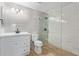 Modern bathroom featuring a walk-in glass shower, updated vanity, and neutral tiling at 2006 N Arrowhead Dr, Chandler, AZ 85224