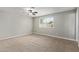Bedroom with neutral carpet, a ceiling fan, and a window with blinds at 2006 N Arrowhead Dr, Chandler, AZ 85224
