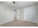 Bedroom featuring plush carpeting, a ceiling fan, and sliding door closet at 2006 N Arrowhead Dr, Chandler, AZ 85224