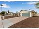 Well-maintained home with a green garage door, neutral paint, desert landscaping, and long driveway at 2006 N Arrowhead Dr, Chandler, AZ 85224