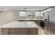 Modern kitchen features white cabinets, stainless steel appliances, and a center island with a countertop at 2006 N Arrowhead Dr, Chandler, AZ 85224
