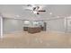 Bright, open kitchen with a center island, stainless steel appliances, and travertine flooring at 2006 N Arrowhead Dr, Chandler, AZ 85224
