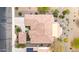 Birds eye view of a home featuring a tile roof and a patio area, with desert landscaping at 20642 N 268Th Dr, Buckeye, AZ 85396