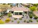 Backyard featuring desert landscaping, a covered patio with outdoor seating, and a tiled roof in a quiet neighborhood at 20642 N 268Th Dr, Buckeye, AZ 85396