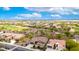 Aerial view of a desert home with a golf course and mountain views at 20642 N 268Th Dr, Buckeye, AZ 85396