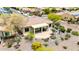 Aerial view of the backyard with desert landscaping, covered patio, and brick accents in a well-maintained residential area at 20642 N 268Th Dr, Buckeye, AZ 85396