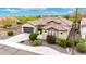 Aerial view of a lovely home with desert landscaping, a tile roof, and a two-car garage at 20642 N 268Th Dr, Buckeye, AZ 85396