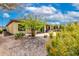 This private backyard with desert landscaping and a covered patio offers a relaxing space at 20642 N 268Th Dr, Buckeye, AZ 85396