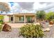 Covered patio in backyard features low maintenance desert landscaping including native cacti at 20642 N 268Th Dr, Buckeye, AZ 85396