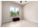 Bedroom with a large window view of the outdoors and light wood floors at 20642 N 268Th Dr, Buckeye, AZ 85396