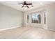 A spacious bedroom with large windows offering natural light and scenic views of the outdoors at 20642 N 268Th Dr, Buckeye, AZ 85396