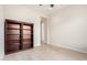 Bedroom featuring an open floorplan with wood-look flooring and a built-in bookshelf at 20642 N 268Th Dr, Buckeye, AZ 85396