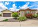 Charming home with well-manicured landscaping, stone accents, and a spacious two-car garage at 20642 N 268Th Dr, Buckeye, AZ 85396