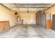 Attached garage with epoxy floors and ample storage cabinets at 20642 N 268Th Dr, Buckeye, AZ 85396