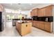 Kitchen with an island, stainless appliances, granite counters, and open floor plan at 20642 N 268Th Dr, Buckeye, AZ 85396