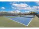 Well-maintained tennis courts with green and blue surfaces, enclosed by fencing at 20642 N 268Th Dr, Buckeye, AZ 85396
