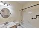 Clean, well-lit bathroom featuring a vanity, mirror, toilet, and shower-tub combination at 2312 E Williams Dr, Phoenix, AZ 85024