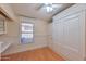 Charming bedroom showcasing wood floors, built-in cabinetry, and a window at 2312 E Williams Dr, Phoenix, AZ 85024
