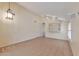 Spacious living room with neutral walls, tile flooring, high ceilings and modern track lighting at 2312 E Williams Dr, Phoenix, AZ 85024