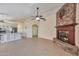 Cozy living space with a striking stone fireplace, and tile flooring, perfect for relaxing at 2312 E Williams Dr, Phoenix, AZ 85024