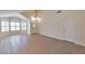 Open living area featuring tile floors, multiple windows for natural light, and vaulted ceilings at 2312 E Williams Dr, Phoenix, AZ 85024