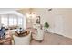 Bright living room boasts vaulted ceilings, large windows, and stylish furnishings for comfortable living at 2312 E Williams Dr, Phoenix, AZ 85024