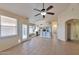 Open living room offering ample seating, tile flooring, and modern appliances throughout at 2312 E Williams Dr, Phoenix, AZ 85024